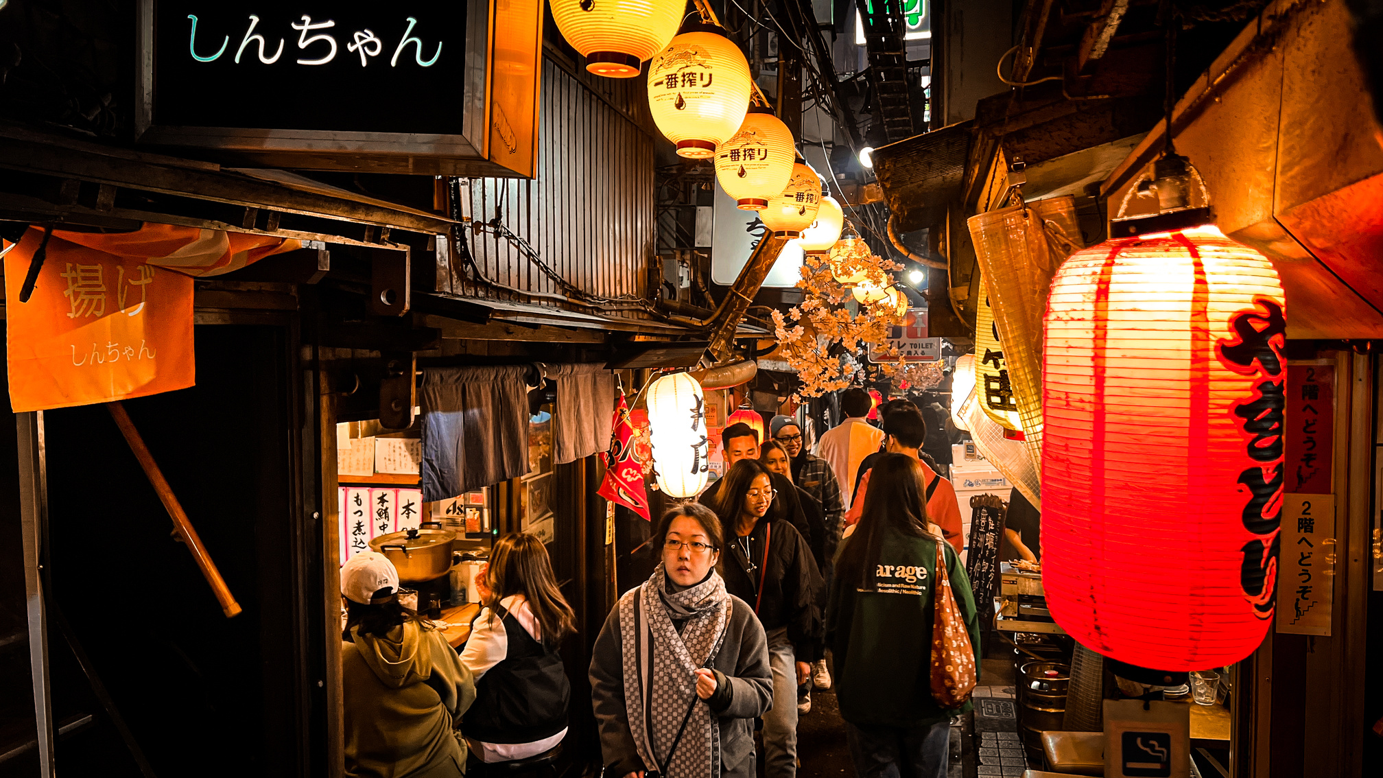 People passing through an alley in Japan